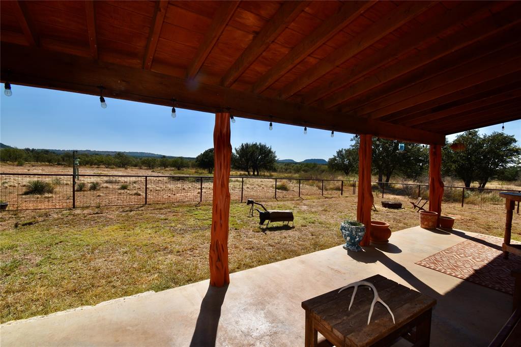 19319 Ranch Road 1871 Mason, TX 76856 - Photo 32 of 40 a view of a balcony with lake view and a floor to ceiling window