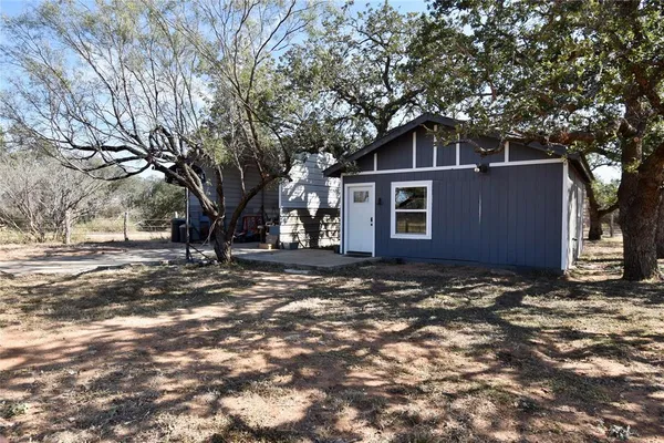 a view of a covered with trees in the background