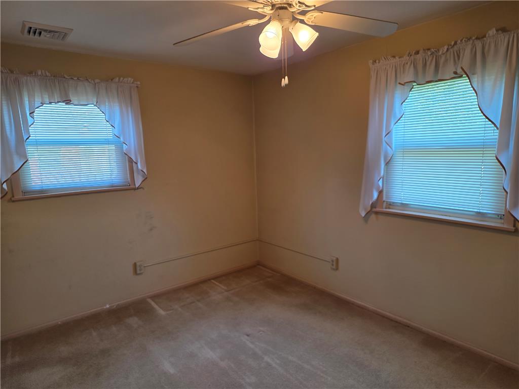3134 Roxford Road Allentown, PA 18103 - Photo 25 of 34 Comfortable bedroom with ample natural light from two windows and a ceiling fan for climate control.