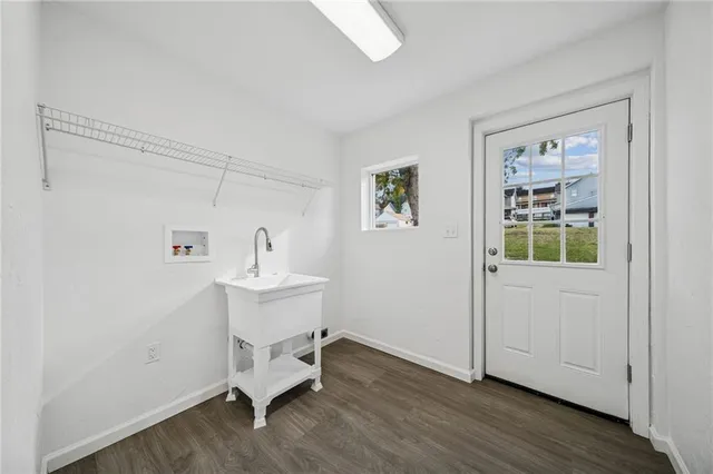 a view of a bathroom from the hallway