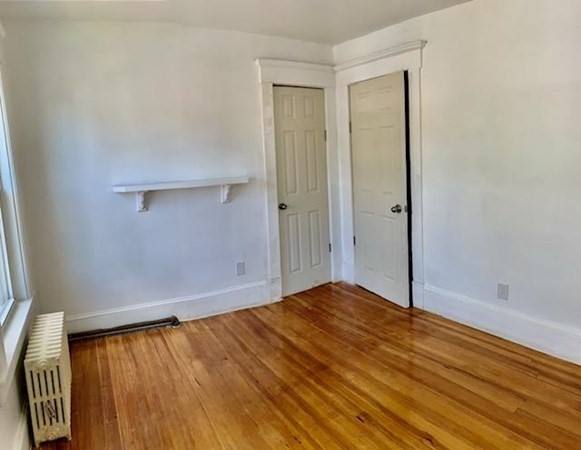 277 Redlands Street Springfield, MA 01104 - Photo 25 of 40 a view of empty room with wooden floor