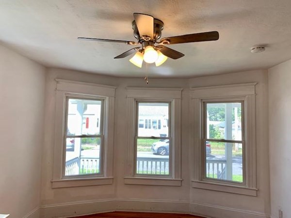 277 Redlands Street Springfield, MA 01104 - Photo 6 of 40 a view of a windows and a chandelier fan in a room