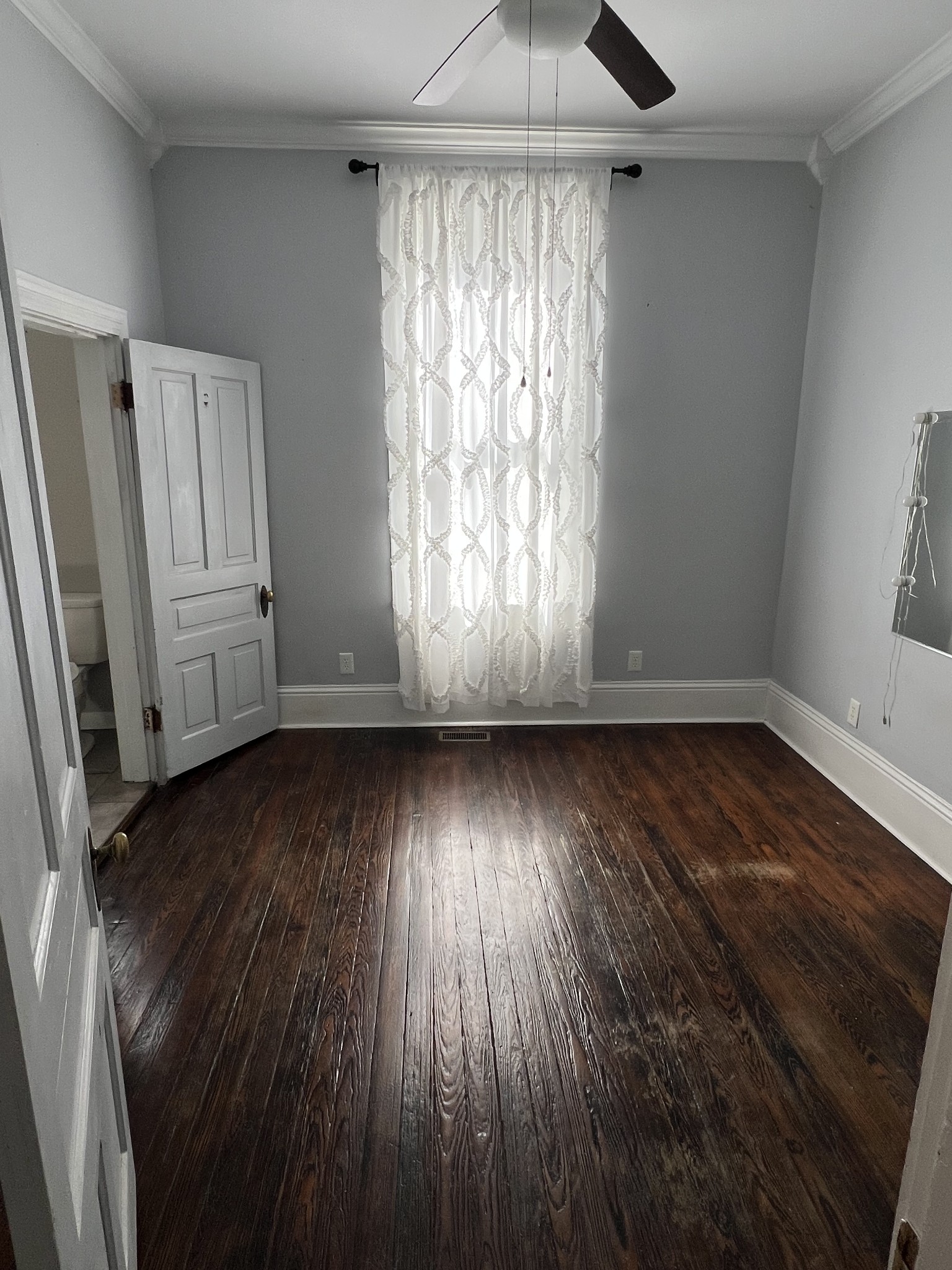 201 Pleasant Street Mount Pleasant, TN 38474 - Photo 18 of 38 an empty room with wooden floor and windows