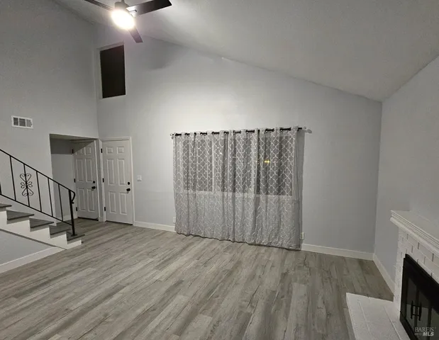 a view of a livingroom with wooden floor