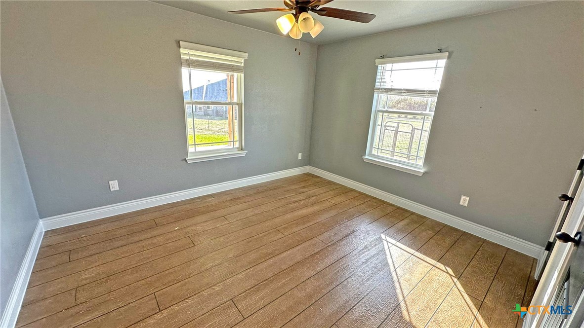 1142 Lutheran Church Road Copperas Cove, TX 76522 - Photo 19 of 48 a view of an empty room with wooden floor and a window