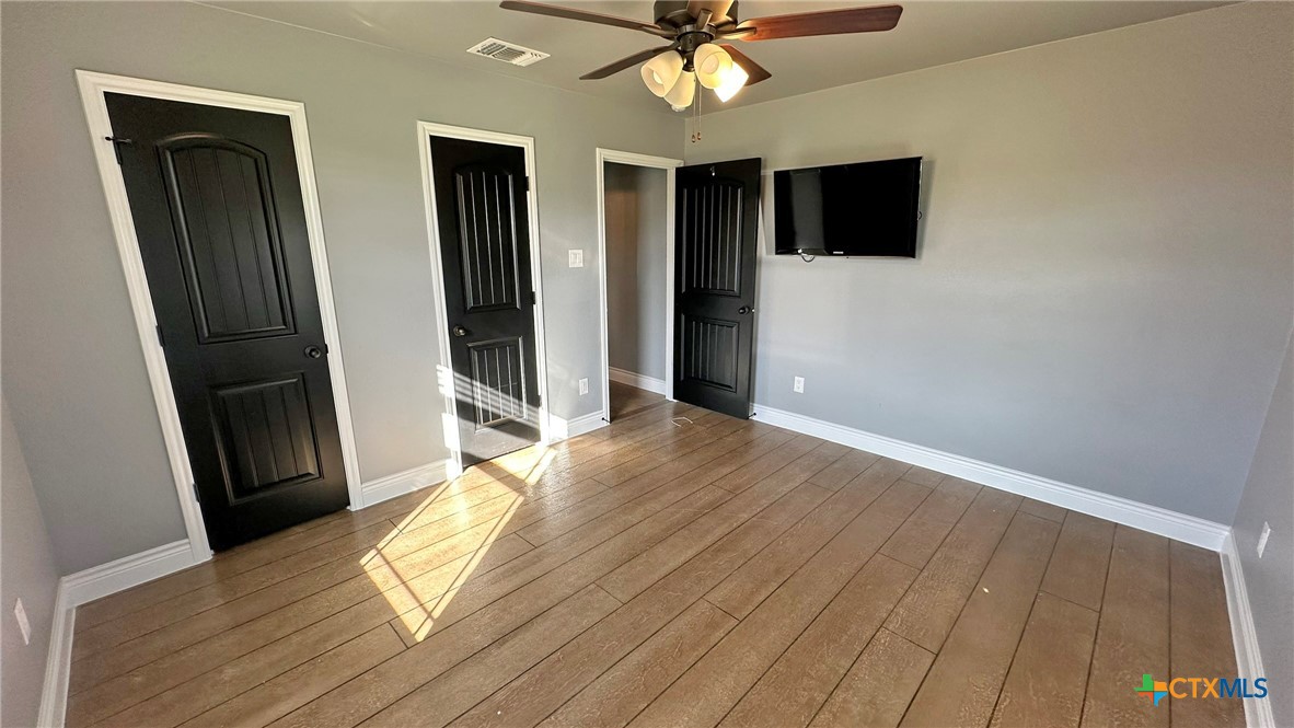 1142 Lutheran Church Road Copperas Cove, TX 76522 - Photo 20 of 48 a view of livingroom with hardwood floor and a ceiling fan