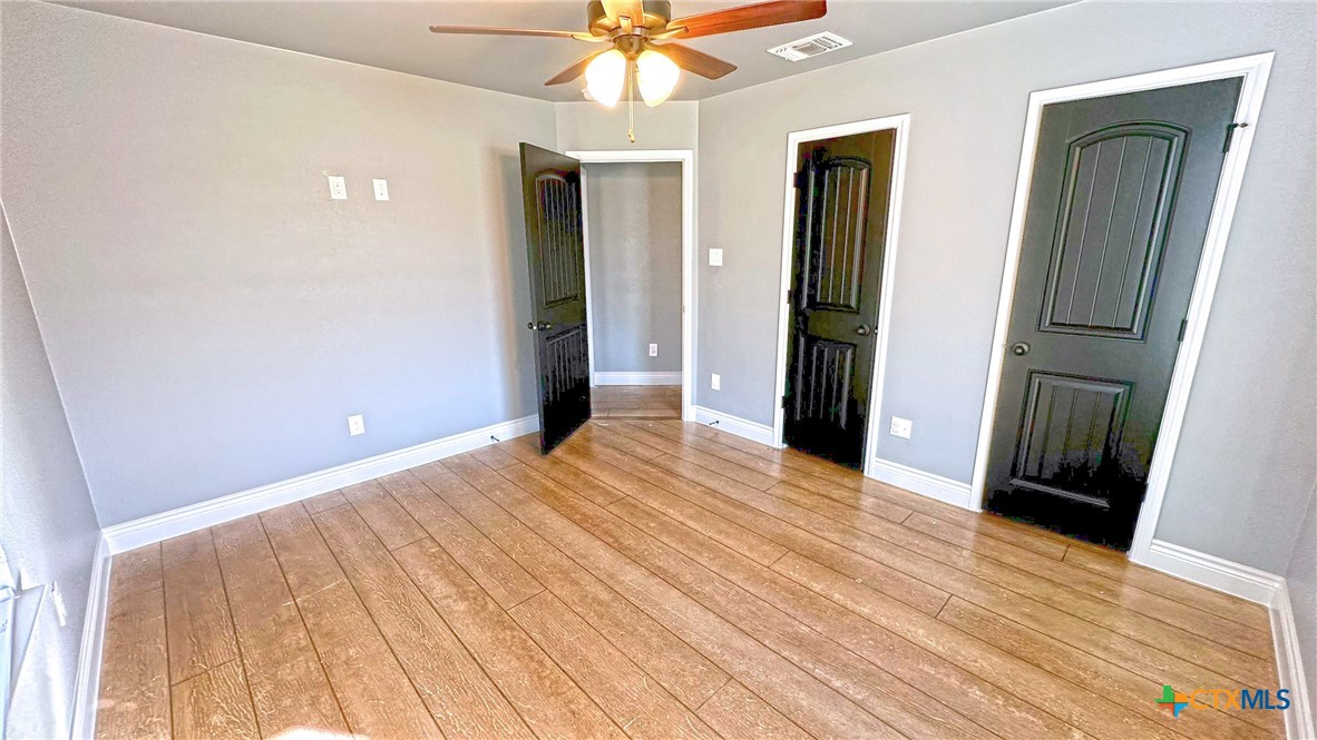 1142 Lutheran Church Road Copperas Cove, TX 76522 - Photo 22 of 48 a view of an empty room with wooden floor and a window
