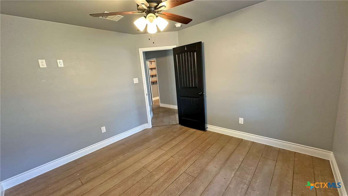 1142 Lutheran Church Road Copperas Cove, TX 76522 - Photo 24 of 48 an empty room with closet and a chandelier fan