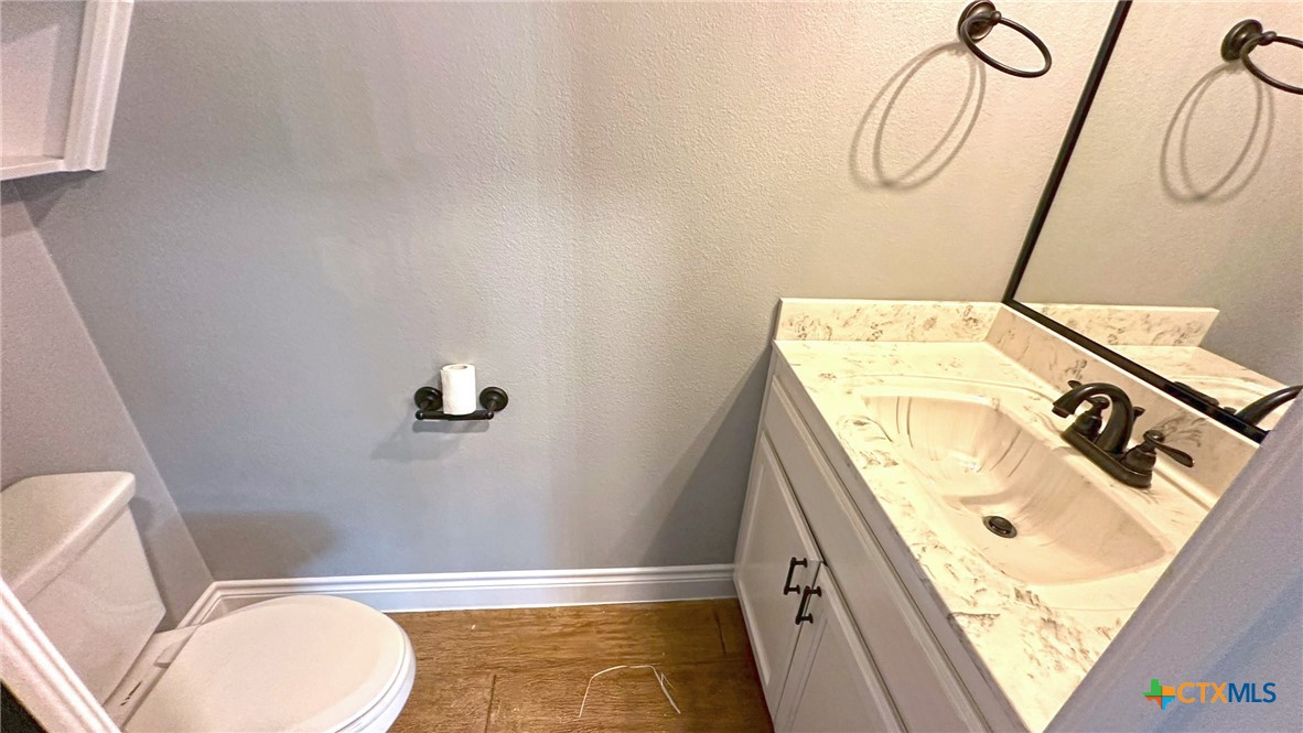 1142 Lutheran Church Road Copperas Cove, TX 76522 - Photo 27 of 48 a bathroom with a sink a toilet and shower