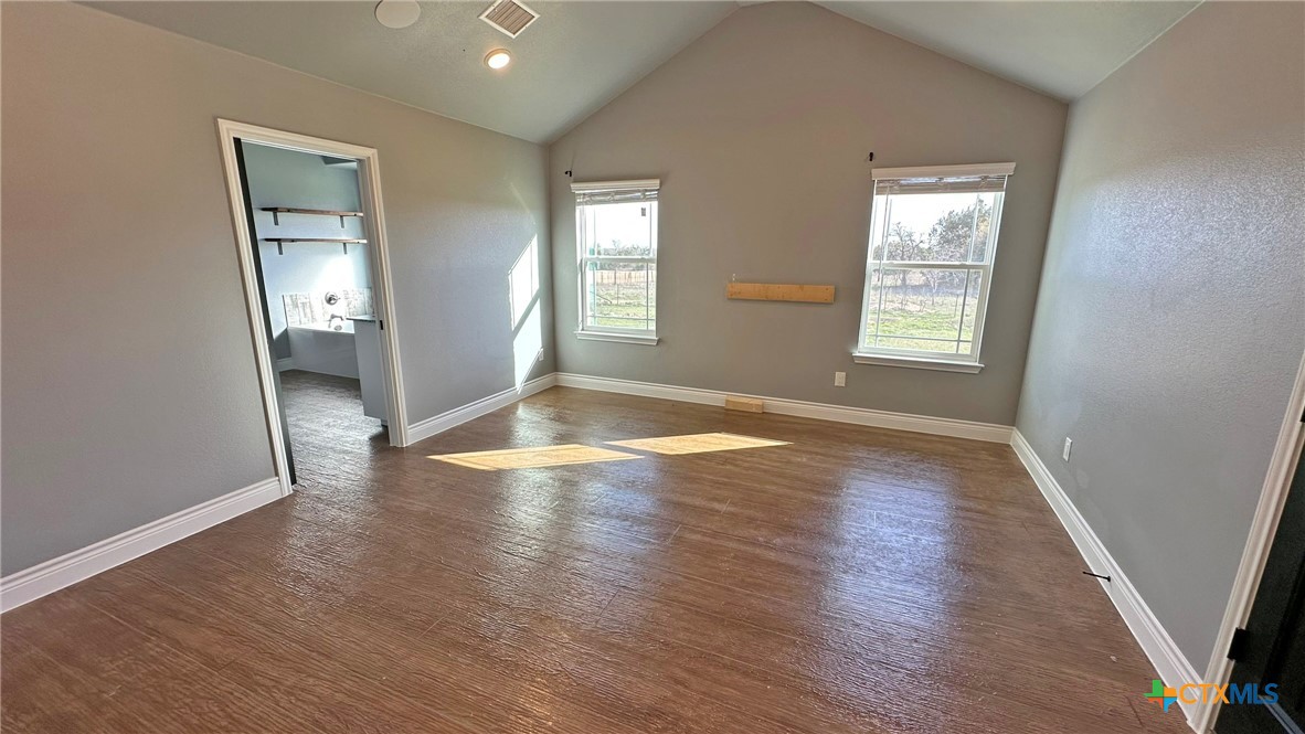 1142 Lutheran Church Road Copperas Cove, TX 76522 - Photo 35 of 48 an empty room with wooden floor and windows