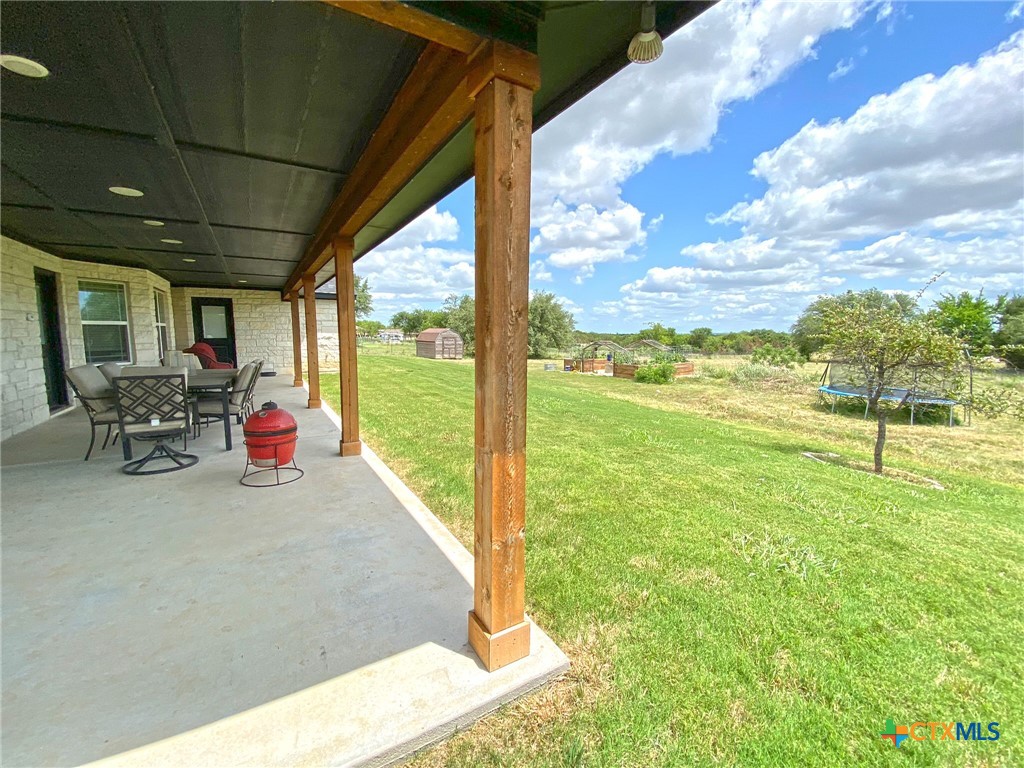 1142 Lutheran Church Road Copperas Cove, TX 76522 - Photo 38 of 48 a view of a patio with table and chairs next to a yard