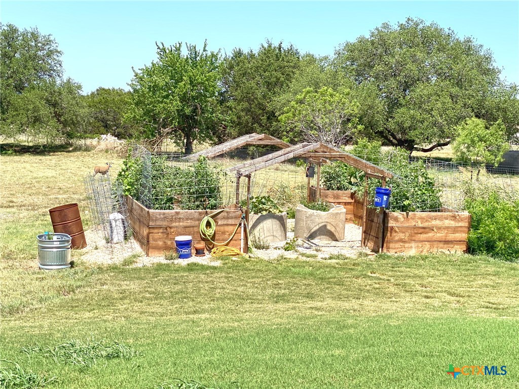 1142 Lutheran Church Road Copperas Cove, TX 76522 - Photo 42 of 48 a view of a house with lawn chairs and a big yard