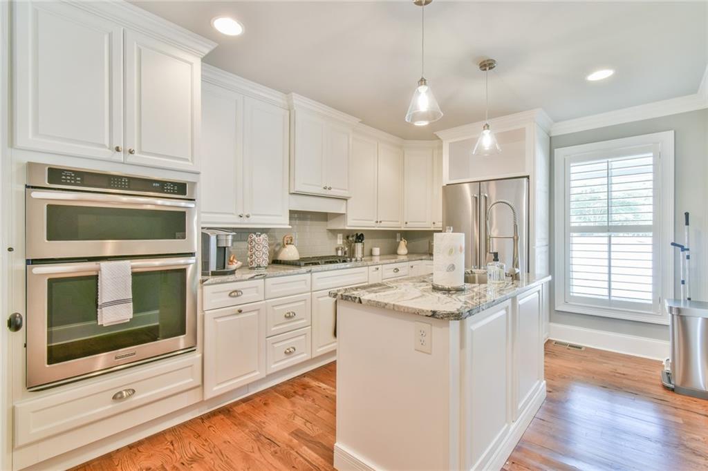 1060 A Bertram Road Augusta, GA 30909 - Photo 15 of 30 a kitchen with stainless steel appliances granite countertop a stove a sink and a refrigerator
