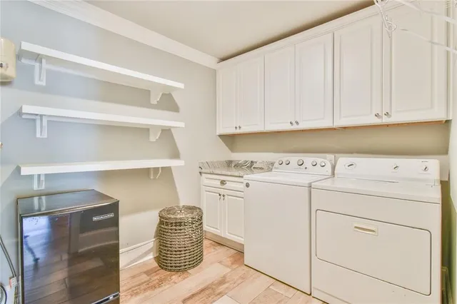 a kitchen with cabinets appliances and racks