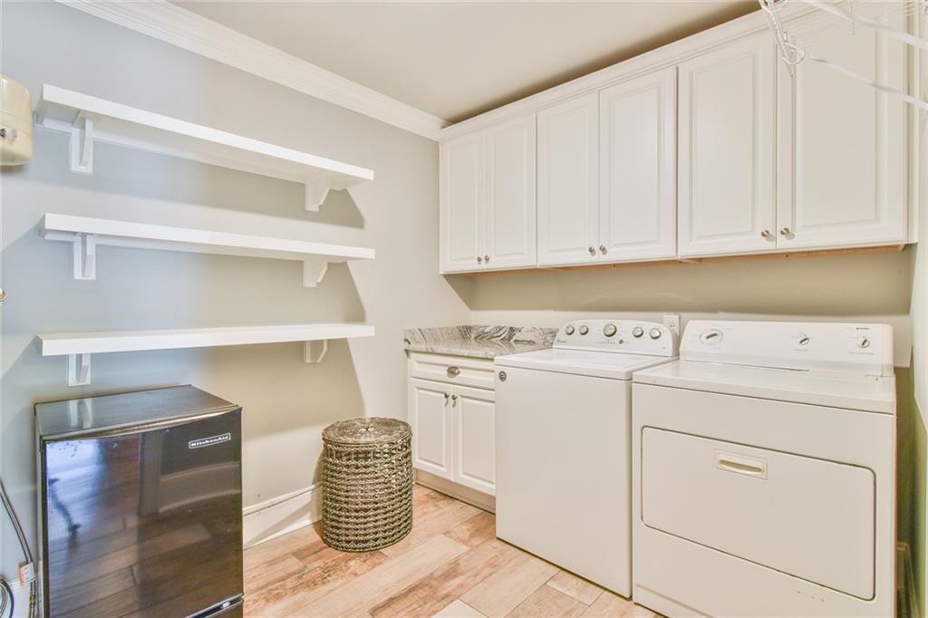 1060 A Bertram Road Augusta, GA 30909 - Photo 20 of 30 a kitchen with cabinets appliances and racks
