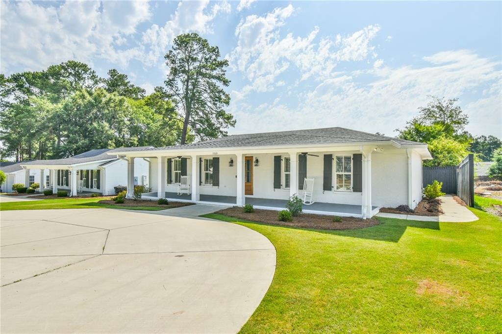1060 A Bertram Road Augusta, GA 30909 - Photo 2 of 30 a view of a house with swimming pool and a yard