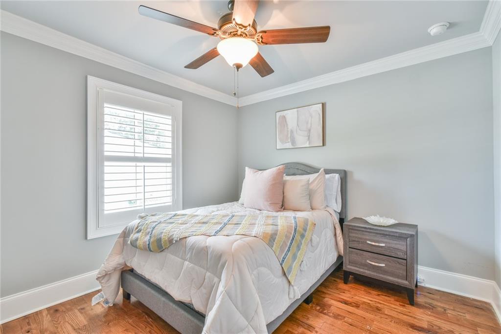 1060 A Bertram Road Augusta, GA 30909 - Photo 22 of 30 a bedroom with a bed and a ceiling fan