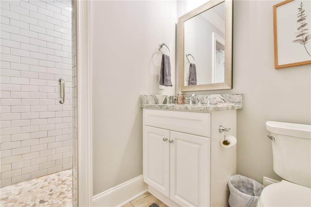 1060 A Bertram Road Augusta, GA 30909 - Photo 23 of 30 a bathroom with a sink vanity mirror and toilet