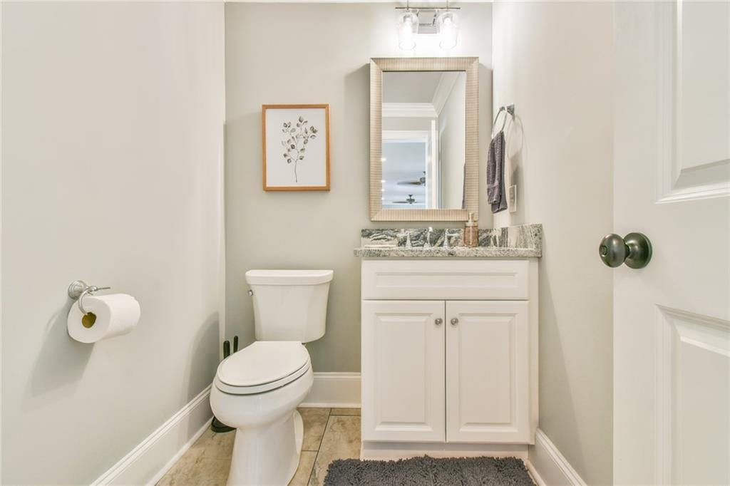 1060 A Bertram Road Augusta, GA 30909 - Photo 25 of 30 a bathroom with a toilet sink vanity and mirror