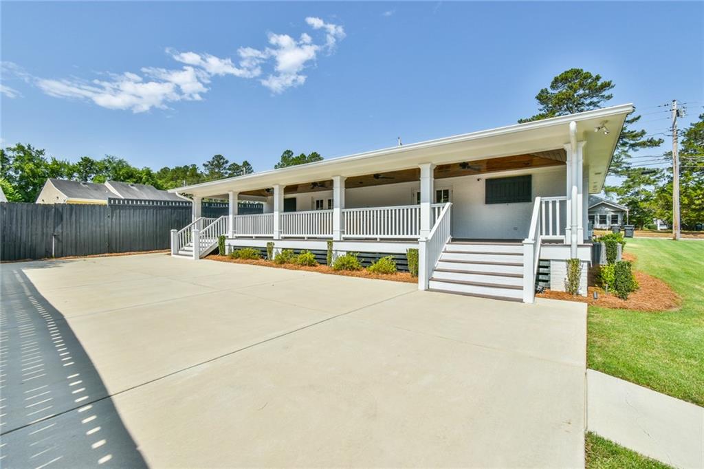 1060 A Bertram Road Augusta, GA 30909 - Photo 27 of 30 a view of a house with a backyard and a garden
