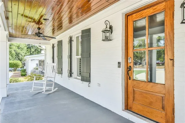 image of a room with wooden floor and windows