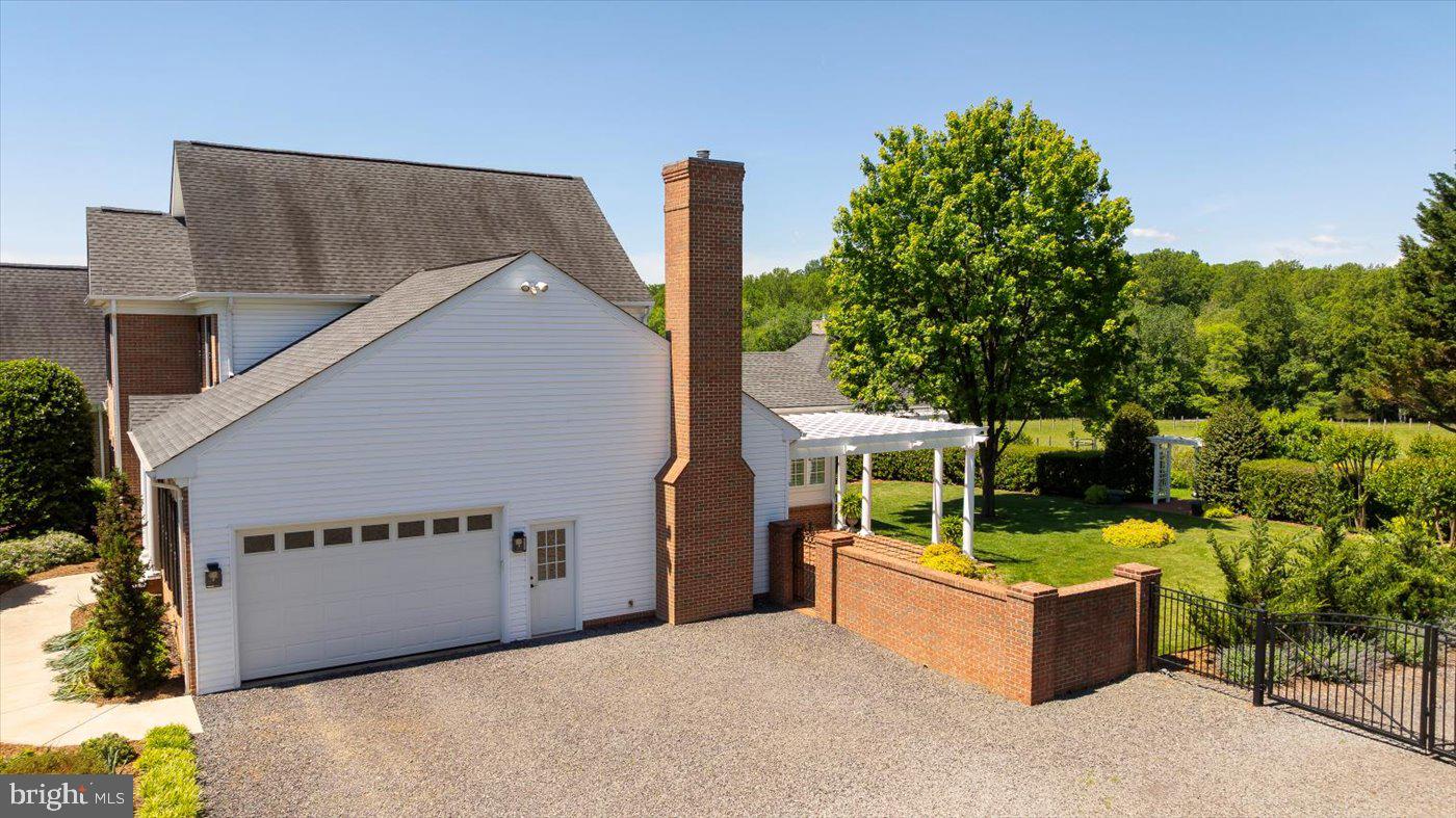 10042 Cedar Spring Lane Culpeper, VA 22701 - Photo 17 of 111 Driveway leads to the side loading 2 car garage