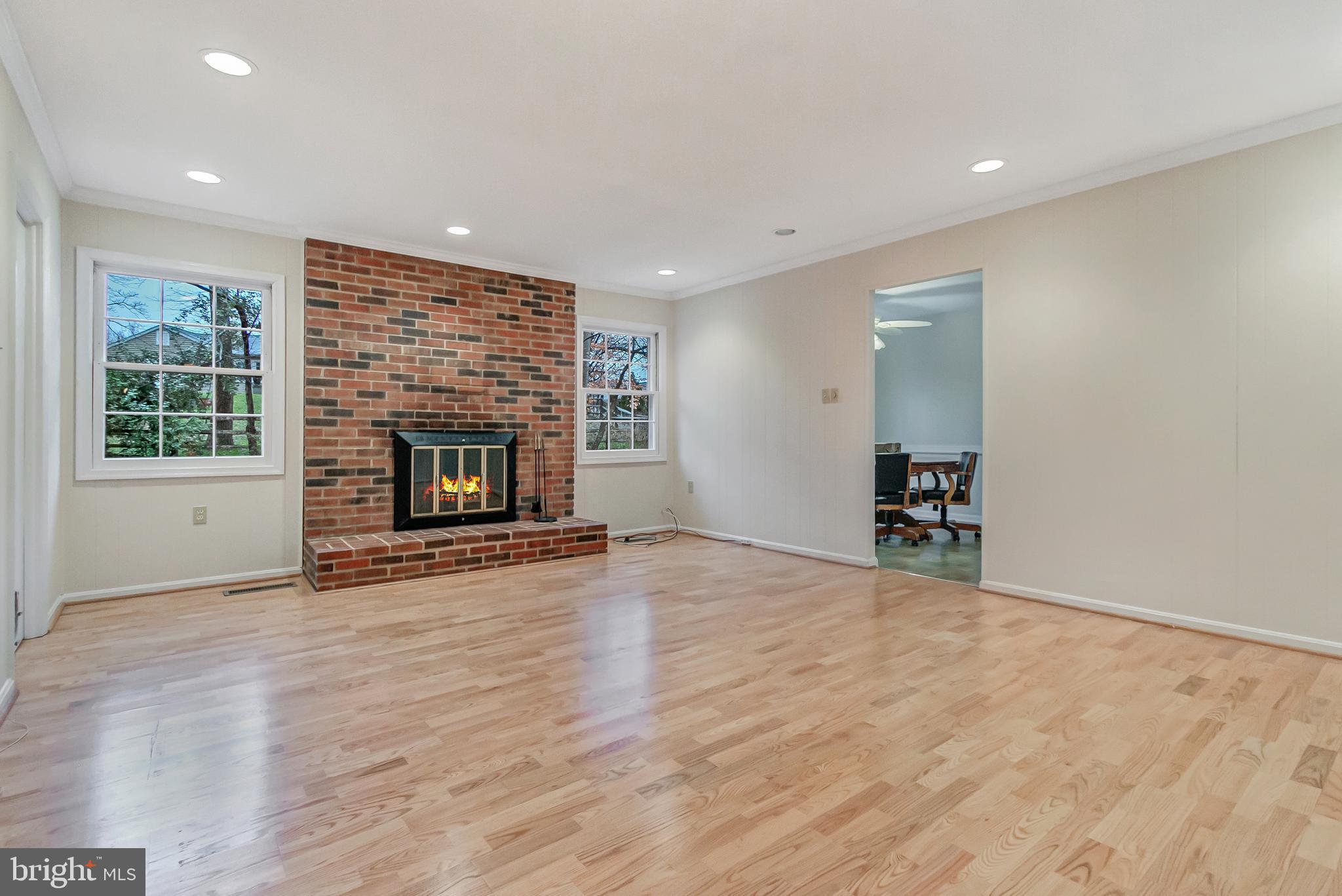 2936 Birchtree Lane Silver Spring, MD 20906 - Photo 16 of 38 Family room with laminate wood floors