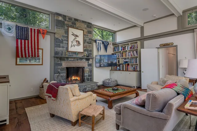 a kitchen with stainless steel appliances a stove a sink and a microwave