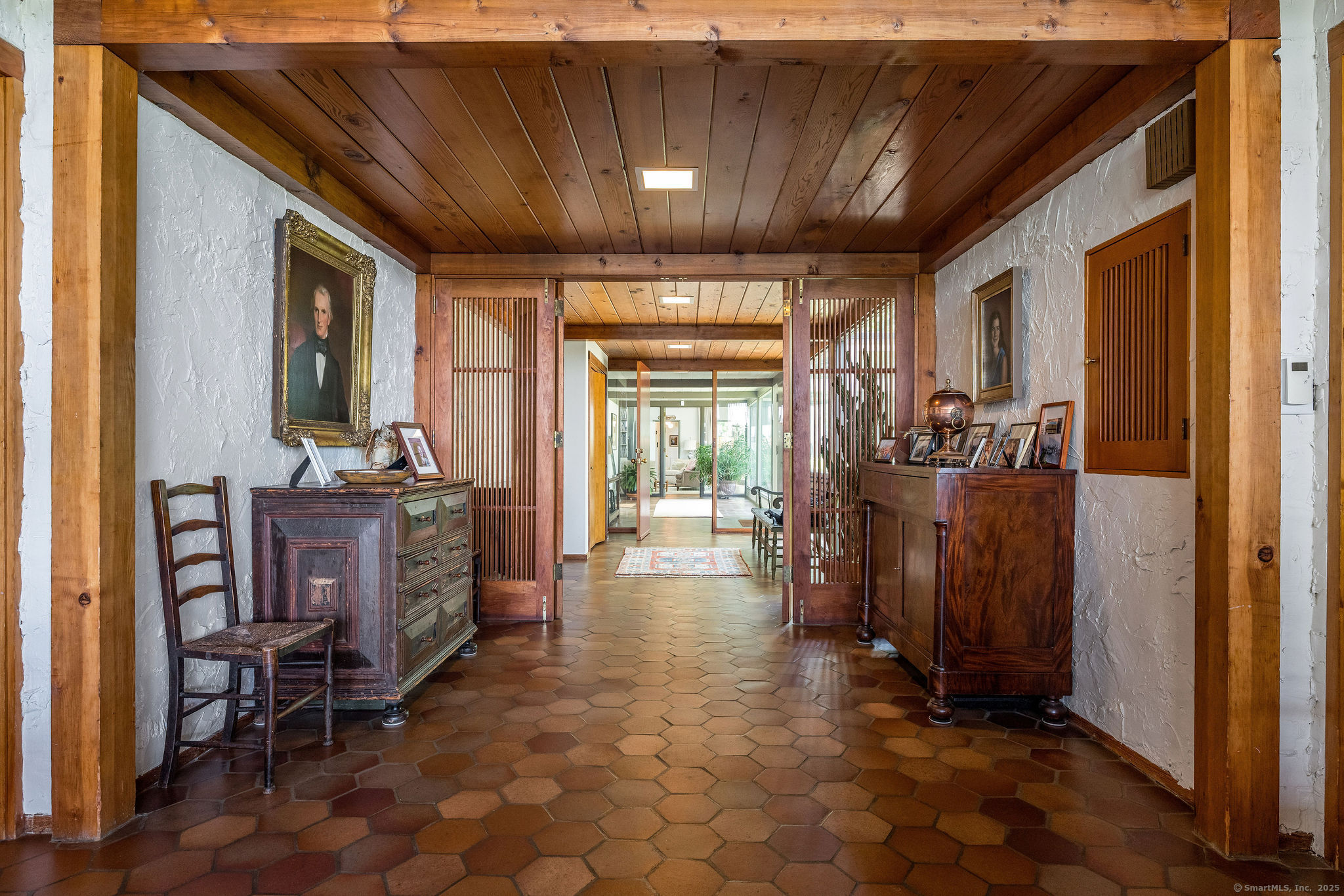 41 Watrous Point Road Old Saybrook, CT 06475 - Photo 14 of 40 a view of a hallway with wooden shelves