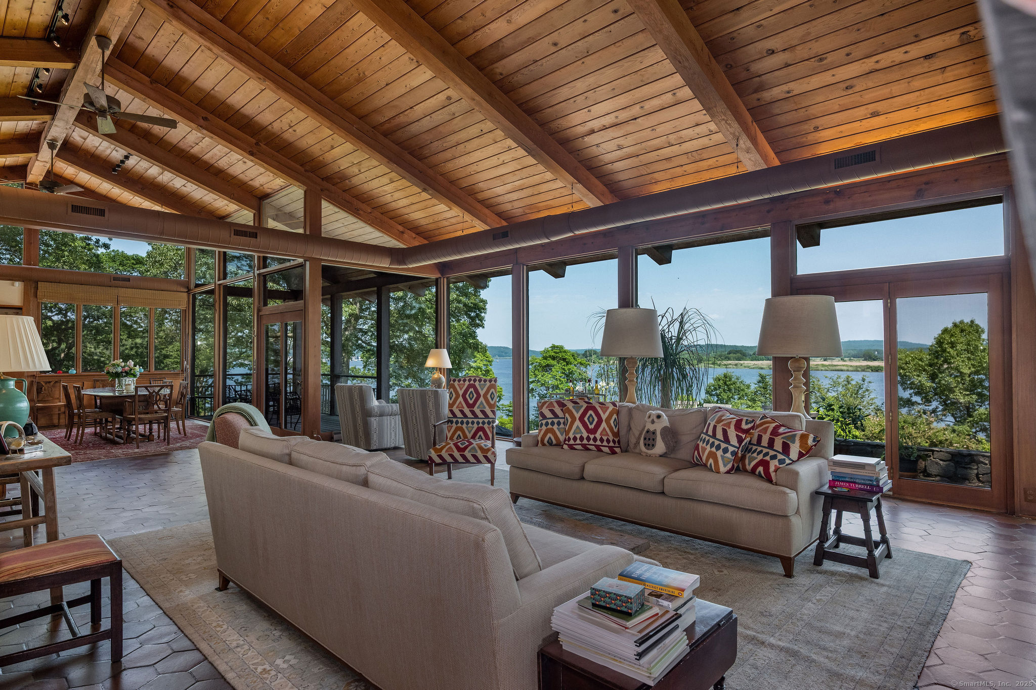 41 Watrous Point Road Old Saybrook, CT 06475 - Photo 15 of 40 a living room with furniture and a large window