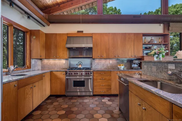 a living room with furniture and a bookshelf