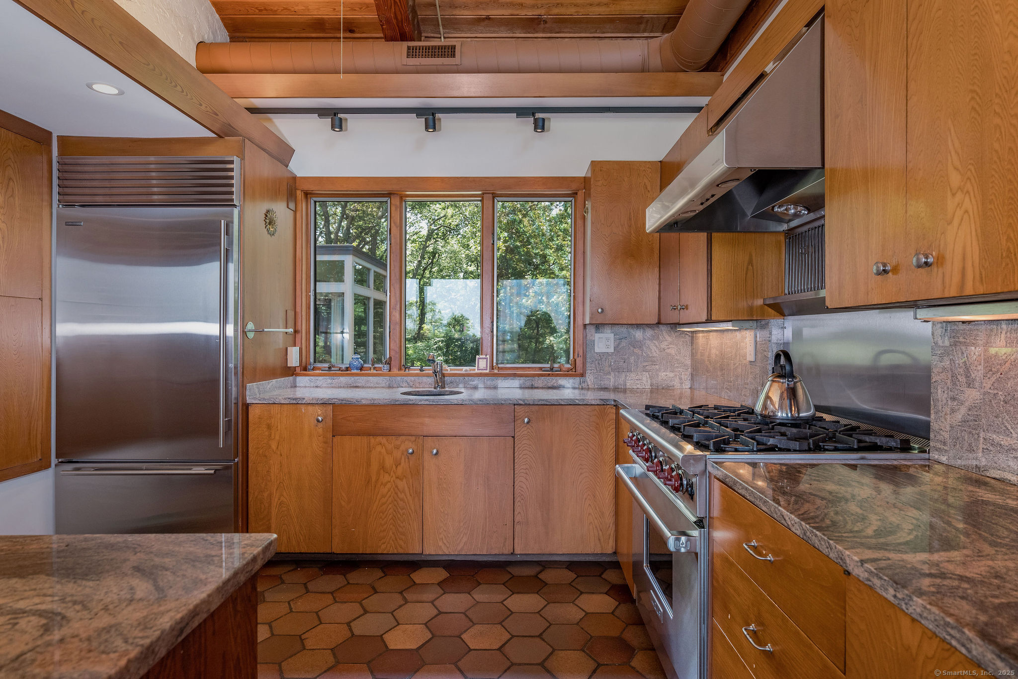 41 Watrous Point Road Old Saybrook, CT 06475 - Photo 19 of 40 a kitchen with stainless steel appliances granite countertop a sink stove and refrigerator