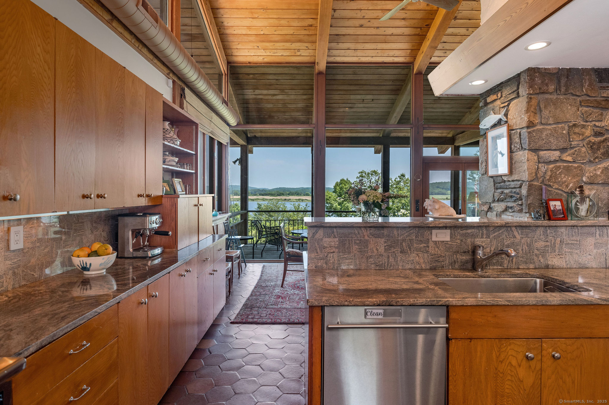 41 Watrous Point Road Old Saybrook, CT 06475 - Photo 20 of 40 a kitchen with stainless steel appliances granite countertop a sink and counter space