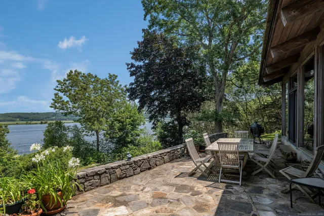 a spacious bathroom with a tub sink a shower and mirror