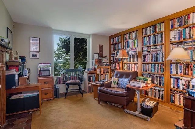 a bathroom with a sink a bathtub and a window