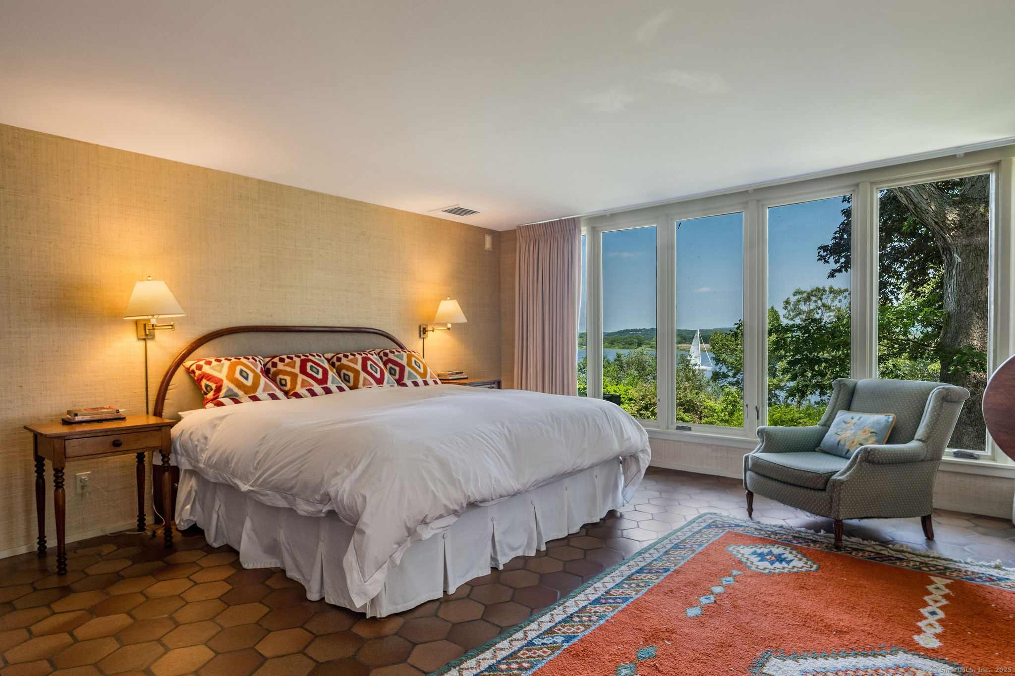 41 Watrous Point Road Old Saybrook, CT 06475 - Photo 27 of 40 a bedroom with a bed and glass window