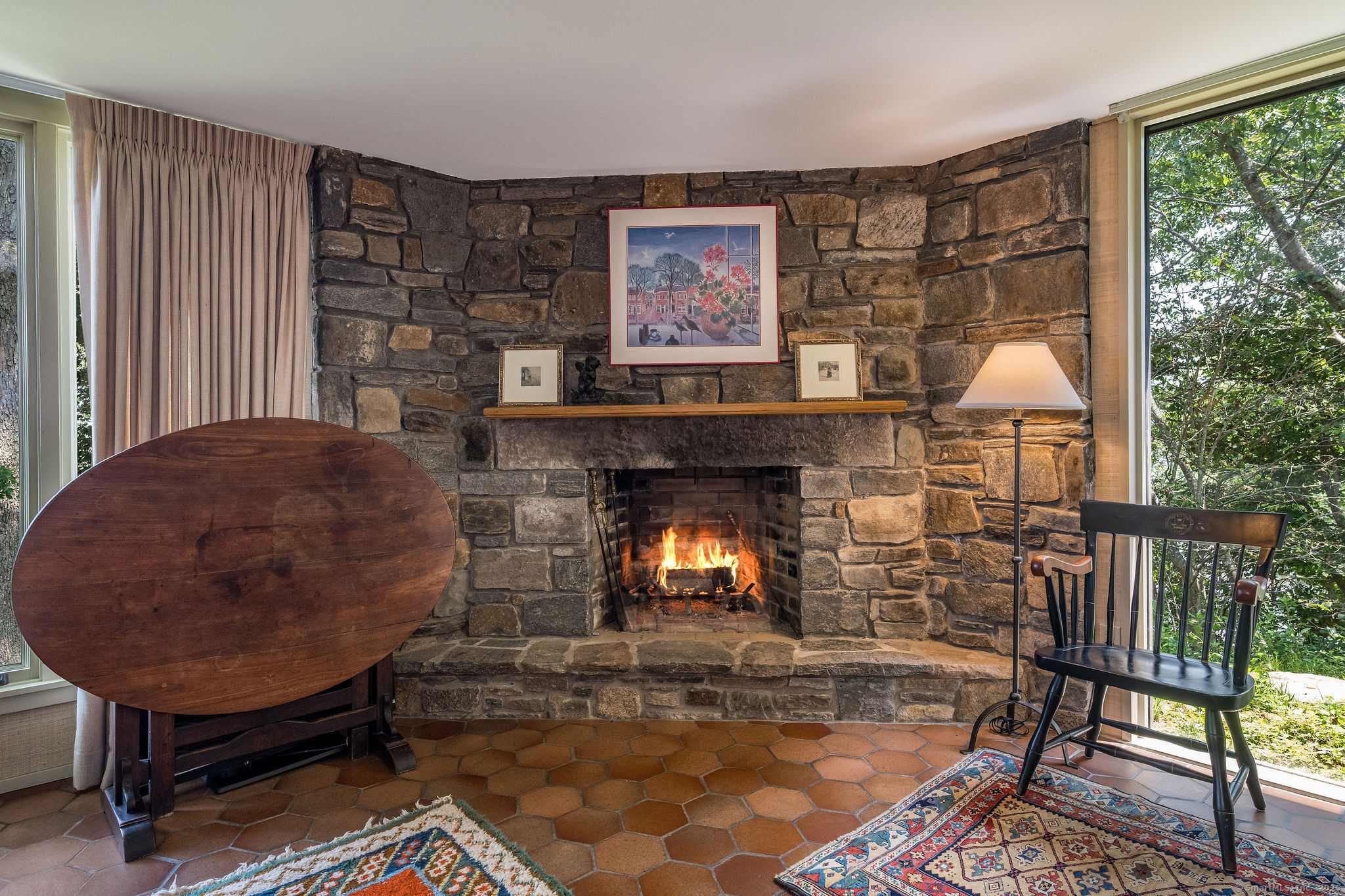 41 Watrous Point Road Old Saybrook, CT 06475 - Photo 28 of 40 a living room with furniture and a fireplace