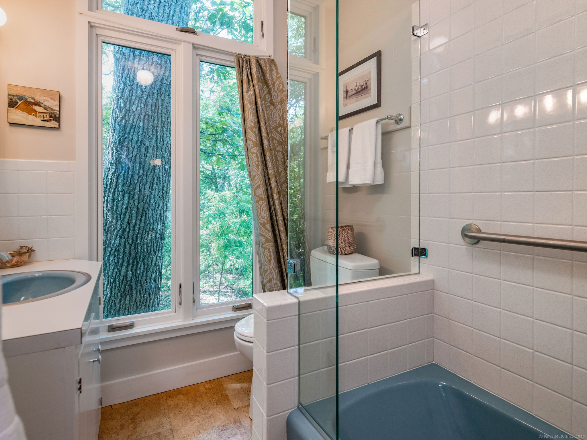 41 Watrous Point Road Old Saybrook, CT 06475 - Photo 34 of 40 a bathroom with a sink a bathtub and a window