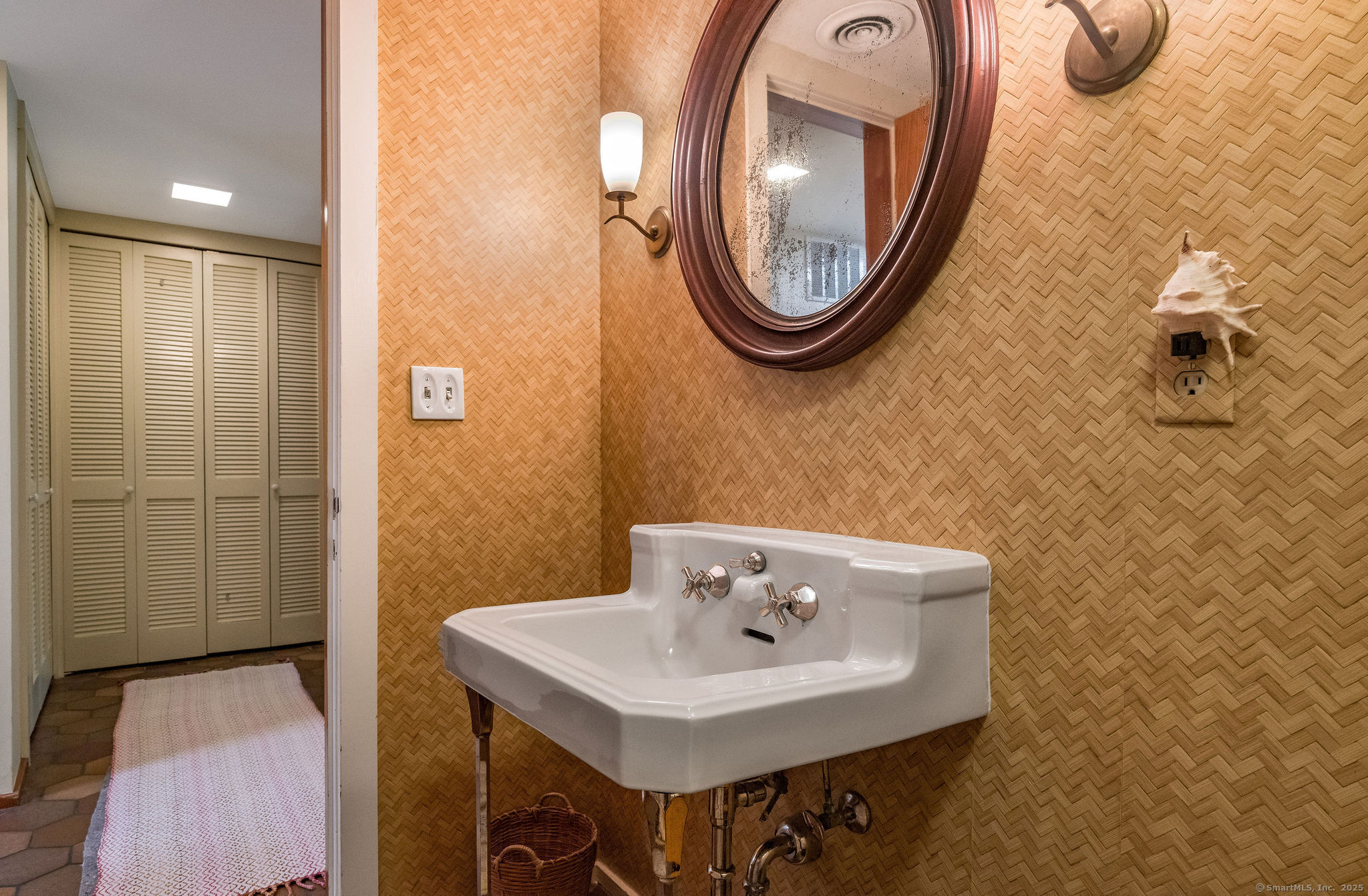 41 Watrous Point Road Old Saybrook, CT 06475 - Photo 36 of 40 a bathroom with a sink and a mirror