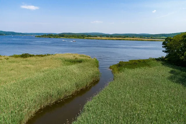 a view of a hallway with wooden shelves