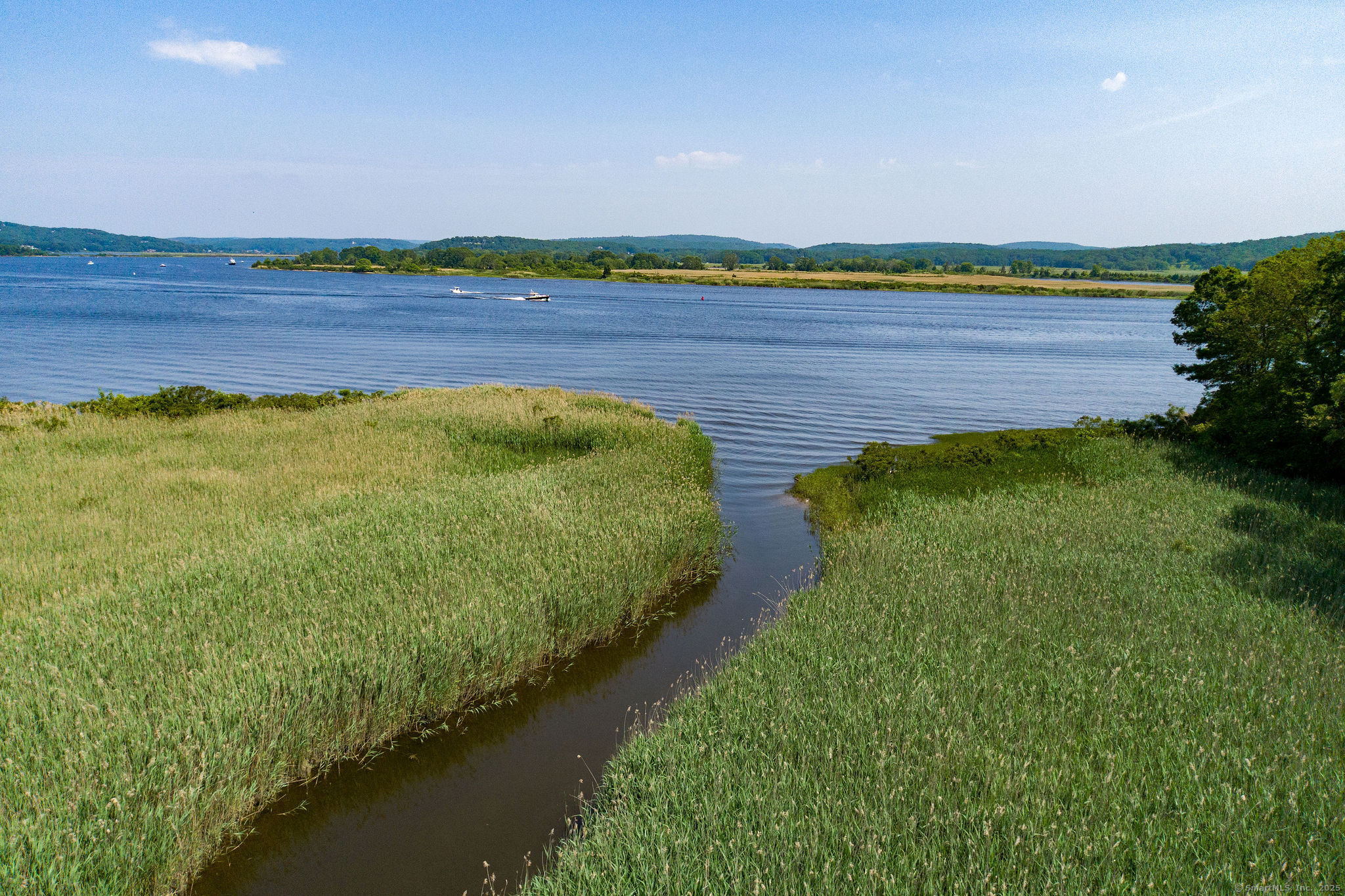 41 Watrous Point Road Old Saybrook, CT 06475 - Photo 8 of 40 a view of a lake with a big yard