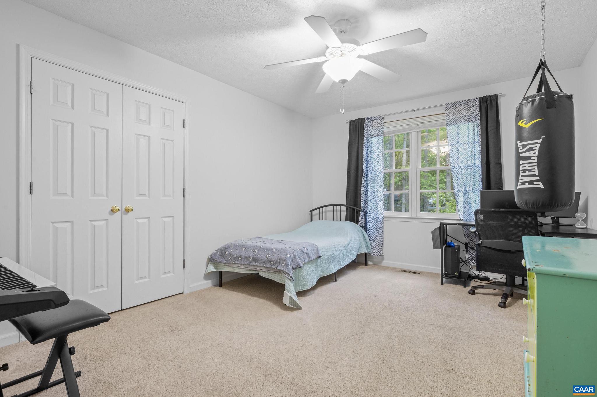 21 Ashton Road Palmyra, VA 22963 - Photo 18 of 35 a spacious bedroom with a bed a desk and chair