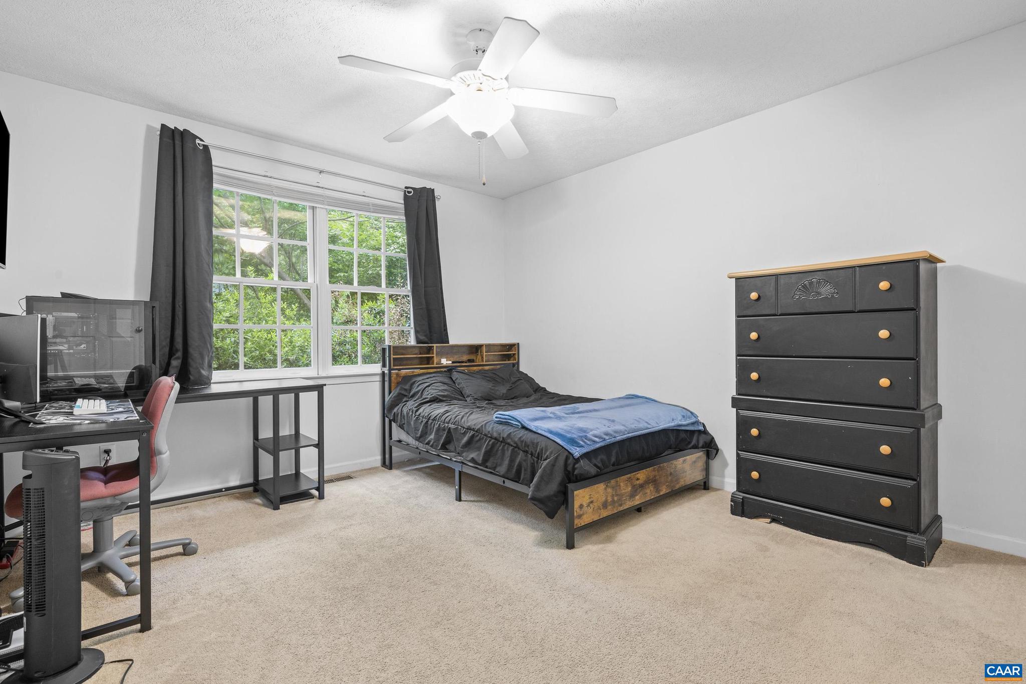 21 Ashton Road Palmyra, VA 22963 - Photo 23 of 35 a spacious bedroom with a bed a chair and a large window