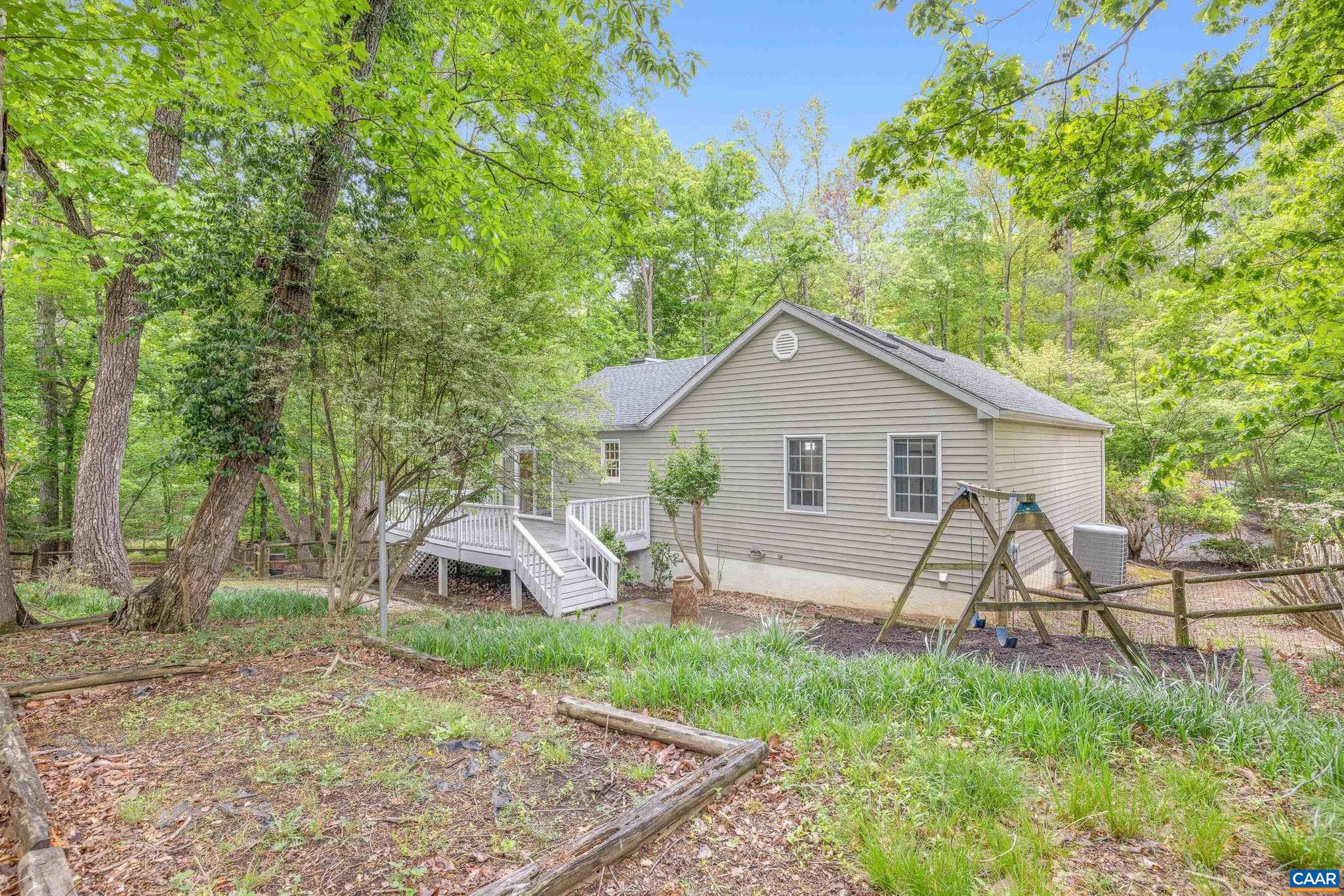 21 Ashton Road Palmyra, VA 22963 - Photo 33 of 35 a view of a house with backyard and a garden