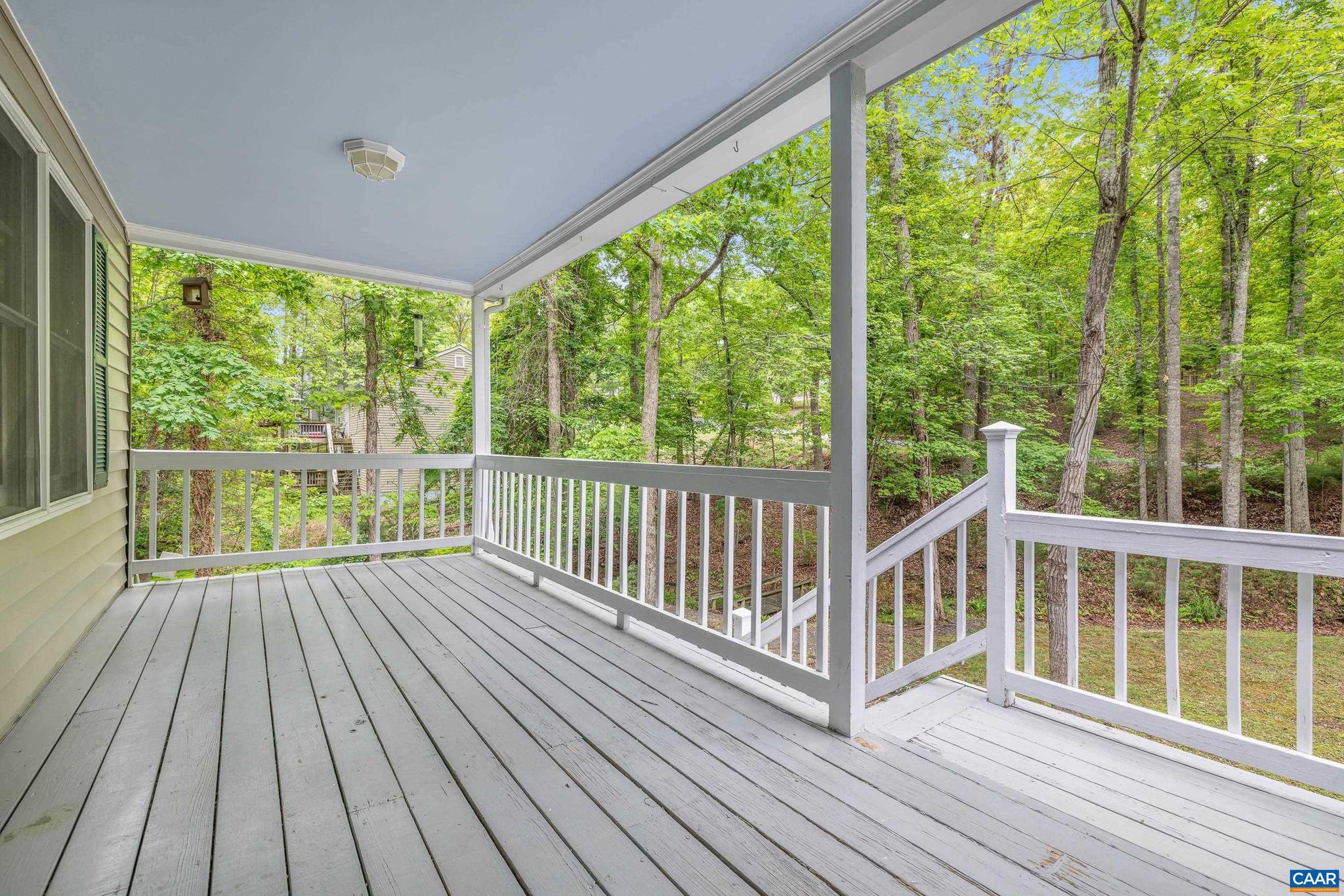 21 Ashton Road Palmyra, VA 22963 - Photo 5 of 35 a view of a wooden deck with large trees