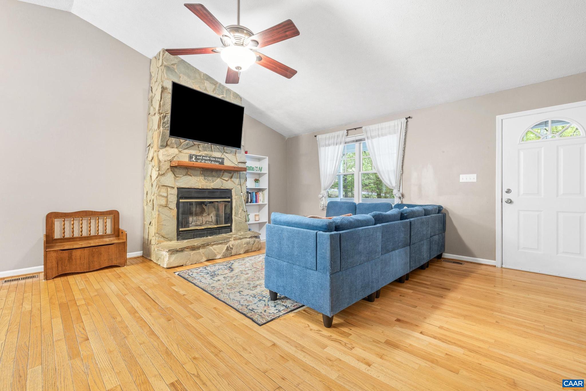 21 Ashton Road Palmyra, VA 22963 - Photo 8 of 35 a living room with a flat screen tv and a fireplace