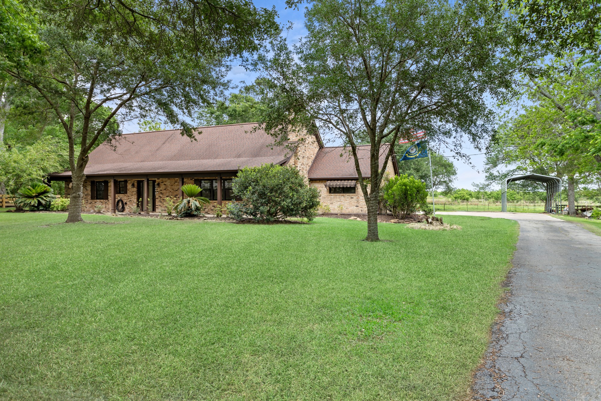 1747 Farm To Market Road 365 Nome, TX 77629 - Photo 1 of 24 a front view of a house with a yard