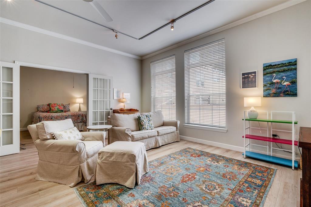 2305 Worthington Street, Unit 104 Dallas, TX 75204 - Photo 11 of 25 a living room with furniture and a rug