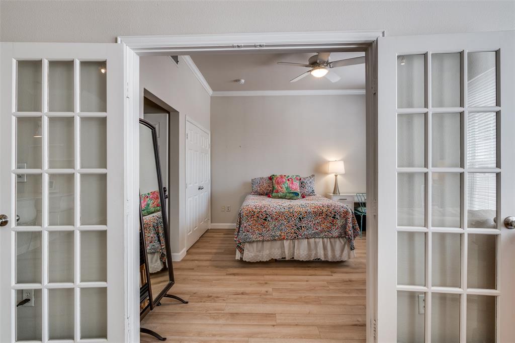 2305 Worthington Street, Unit 104 Dallas, TX 75204 - Photo 12 of 25 a bedroom with a bed and a window