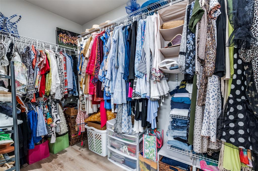 2305 Worthington Street, Unit 104 Dallas, TX 75204 - Photo 16 of 25 a view of walk in closet with clothes